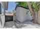 A well-maintained storage shed with a fresh coat of paint sits in the backyard at 1901 Farnam Pl, Las Vegas, NV 89102