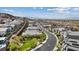 Aerial view of a neighborhood nestled near the mountains, offering convenient access to the city and airport at 1957 Regal Bluff Dr, Henderson, NV 89052