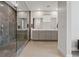 Modern bathroom featuring a glass-enclosed shower and double vanity at 1957 Regal Bluff Dr, Henderson, NV 89052
