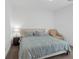 Bright bedroom with a queen bed, blue comforter, a Voyage decorative pillow and neutral walls at 1957 Regal Bluff Dr, Henderson, NV 89052