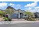Beautiful single-story home with modern design, desert landscaping, and attached garage at 1957 Regal Bluff Dr, Henderson, NV 89052