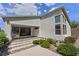 Modern home featuring a decorative walkway, desert landscaping, and large windows for ample natural light at 1957 Regal Bluff Dr, Henderson, NV 89052