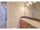 Bathroom featuring tiled counter with colorful tile design and wood cabinets at 2086 Troon Dr, Henderson, NV 89074