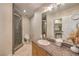 Bathroom with granite countertops, tiled floors and a glass enclosed shower at 2086 Troon Dr, Henderson, NV 89074