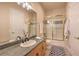 This bathroom features neutral walls and flooring, plus a glassed-in tub and shower at 2086 Troon Dr, Henderson, NV 89074