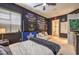 This is a bedroom with a window, a bed, a sofa, and a doorway to a bathroom at 2086 Troon Dr, Henderson, NV 89074
