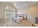 Bright bedroom featuring a ceiling fan and large windows with shutters at 2086 Troon Dr, Henderson, NV 89074