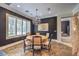 Elegant dining room featuring a round table, chandelier, and large window at 2086 Troon Dr, Henderson, NV 89074