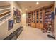 Hallway with wood bookcase, sports memorabilia, and carpeted floor at 2086 Troon Dr, Henderson, NV 89074