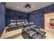 Luxury home theater featuring plush, reclining seats and a vintage popcorn machine for a cinematic experience at 2086 Troon Dr, Henderson, NV 89074