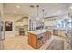 Spacious kitchen with island offers seating, sink, pendant lights, and modern appliances at 2086 Troon Dr, Henderson, NV 89074