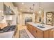 Open concept kitchen includes a large island with seating, stainless steel appliances, and granite counters at 2086 Troon Dr, Henderson, NV 89074