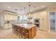 Large kitchen island features seating, granite countertops, and stainless steel appliances at 2086 Troon Dr, Henderson, NV 89074