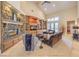 Inviting living room featuring a stone fireplace, built-in shelving, and vaulted ceilings at 2086 Troon Dr, Henderson, NV 89074