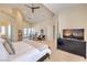 Bright main bedroom with vaulted ceilings, fireplace, and a comfortable sitting area for relaxation at 2086 Troon Dr, Henderson, NV 89074
