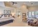 Spacious main bedroom retreat with fireplace, sitting area, and access to a private outdoor space at 2086 Troon Dr, Henderson, NV 89074