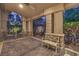 A covered backyard patio features stone pillars and decorative concrete at 2086 Troon Dr, Henderson, NV 89074