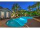 Backyard pool with spa and lush landscaping; perfect for entertaining or relaxing in privacy at 2086 Troon Dr, Henderson, NV 89074