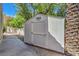 A backyard features a storage shed with mature trees at 2086 Troon Dr, Henderson, NV 89074