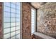 Luxurious bathroom shower featuring marble accents, a built-in seat, and multiple shower heads at 2086 Troon Dr, Henderson, NV 89074