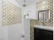 Bathroom with double sinks, decorative tile, and a glass shower stall at 2104 Plaza De La Candela, Las Vegas, NV 89102