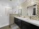 Modern bathroom features double sinks, designer tile, and a spacious shower at 2104 Plaza De La Candela, Las Vegas, NV 89102