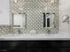 Bathroom with double sinks, a quartz countertop, and decorative mirrors at 2104 Plaza De La Candela, Las Vegas, NV 89102