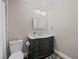 Updated bathroom with a marble sink, modern fixtures, and neutral wall color at 2104 Plaza De La Candela, Las Vegas, NV 89102