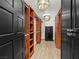 Well-lit walk-in closet features custom shelving, drawers, and a secure safe at 2104 Plaza De La Candela, Las Vegas, NV 89102