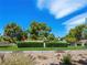 Beautiful common ground area with well-manicured bushes, lush trees, rock landscaping, and pops of color at 2104 Plaza De La Candela, Las Vegas, NV 89102