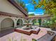 Enchanting courtyard with a tiered fountain, surrounded by elegant archways and lush landscaping at 2104 Plaza De La Candela, Las Vegas, NV 89102
