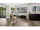 Bright dining nook with large windows, banquette seating, and sleek modern finishes at 2104 Plaza De La Candela, Las Vegas, NV 89102