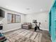 Sunlit exercise room featuring a workout bike and sitting area at 2104 Plaza De La Candela, Las Vegas, NV 89102