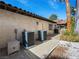 Exterior view of home with pathway, AC units, and well maintained landscaping at 2104 Plaza De La Candela, Las Vegas, NV 89102