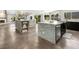 Open-concept kitchen with two islands, modern appliances, light countertops, and plenty of natural light at 2104 Plaza De La Candela, Las Vegas, NV 89102