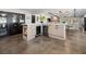 Well-equipped kitchen with wine fridge, stainless steel refrigerator, and natural wood cabinets at 2104 Plaza De La Candela, Las Vegas, NV 89102
