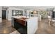 Kitchen island boasts a copper sink, modern faucet, light countertops, and built-in dishwasher at 2104 Plaza De La Candela, Las Vegas, NV 89102
