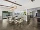 Open-concept living area offers ample space for dining and entertaining with outdoor patio access at 2104 Plaza De La Candela, Las Vegas, NV 89102