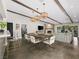 Spacious living area with beamed ceilings, fireplace, and seamless access to the outdoor patio at 2104 Plaza De La Candela, Las Vegas, NV 89102
