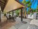 Inviting covered patio features tiled flooring and a dining area, perfect for outdoor entertaining and relaxation at 2104 Plaza De La Candela, Las Vegas, NV 89102