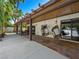 Charming covered patio with hanging chairs offers a relaxing outdoor space for enjoying the fresh air at 2104 Plaza De La Candela, Las Vegas, NV 89102