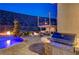 Stunning backyard with a built-in BBQ, pool, and fire pit for entertaining at 2124 Pont National Dr, Henderson, NV 89044