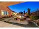 Inviting backyard with a cozy fire pit and manicured landscaping at 2124 Pont National Dr, Henderson, NV 89044