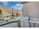 Outdoor kitchen and elevated patio seating area in the backyard with views at 2124 Pont National Dr, Henderson, NV 89044