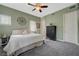 Cozy bedroom with a ceiling fan, a black dresser, and natural light at 2124 Pont National Dr, Henderson, NV 89044