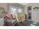 ' bedroom features plush carpeting, a daybed, a play tent and shelving at 2124 Pont National Dr, Henderson, NV 89044