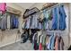 Organized walk-in closet with ample storage space for clothing and luggage at 2124 Pont National Dr, Henderson, NV 89044