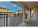 Inviting courtyard featuring a metal fence, a stamped concrete patio, and access to the home's entrance at 2124 Pont National Dr, Henderson, NV 89044