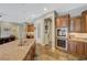 Gourmet kitchen featuring granite countertops, stainless steel appliances, and custom cabinetry at 2124 Pont National Dr, Henderson, NV 89044