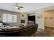 Comfortable living room with lots of light, a cozy fireplace, and views of the mountains at 2124 Pont National Dr, Henderson, NV 89044